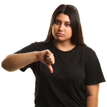 A woman giving a thumbs down. 