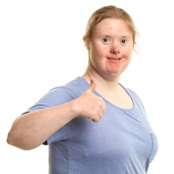 A young woman is smiling and giving a thumbs up.